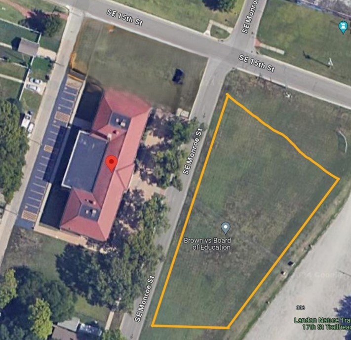 A trapezoid-shaped area directly to the east of the visitor center and Monroe Street.