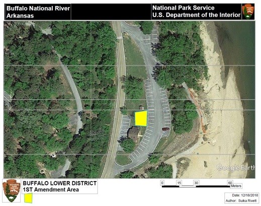 Google Earth photo with road and parking area for Buffalo Point picnic area with yellow trapezoid for 1st amendment area