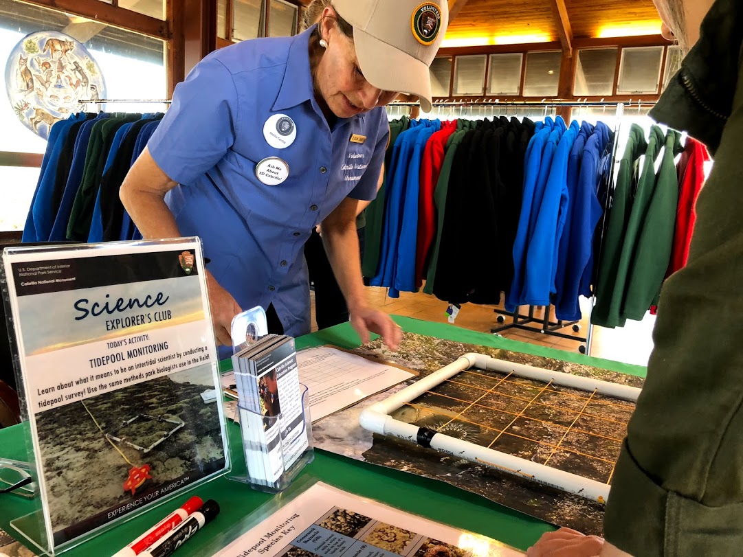 Volunteer Cecilia Carrick talks to visitors during the first ever Science Explorer’s Club day on January 4. This activity was all about the science of tidepool monitoring.