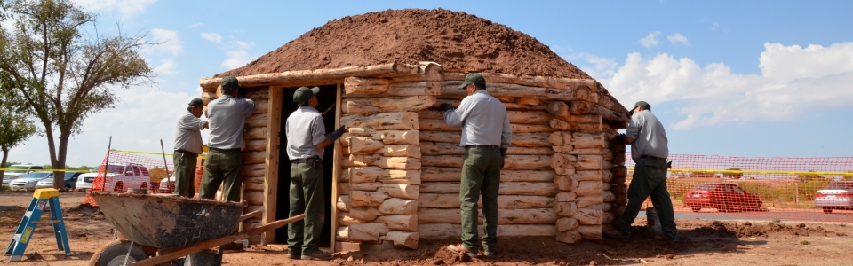 NPS Staff working on traditional Navajo home