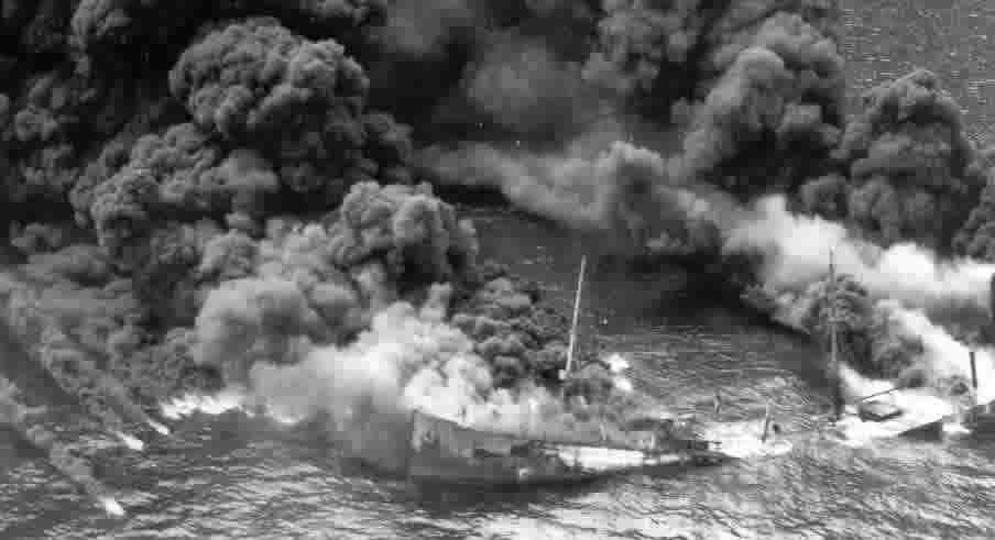 The tanker Byron D. Benson burns off the North Carolina coast, April 3, 1942.