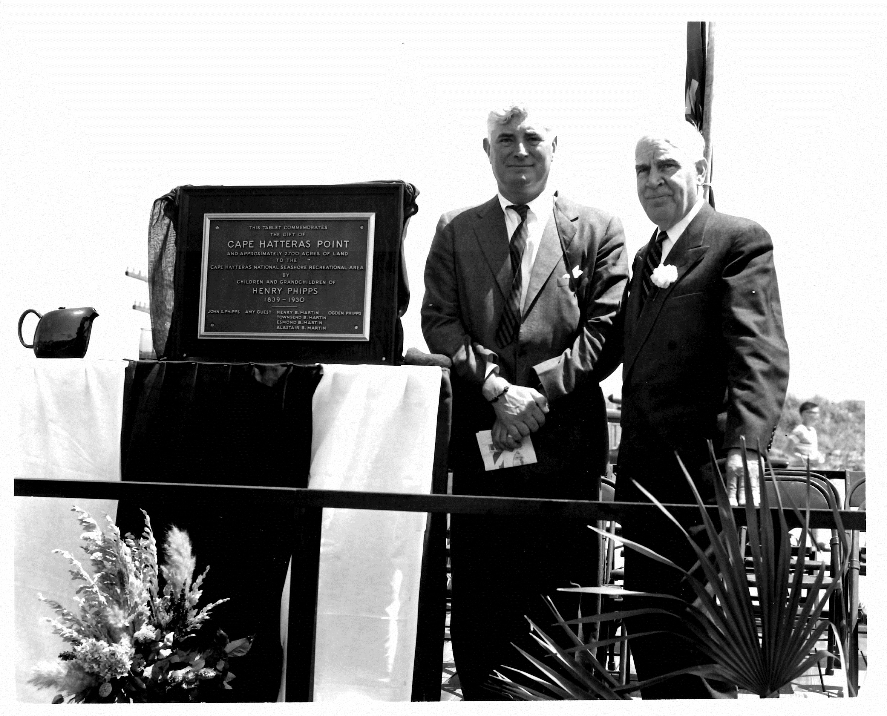 (L-R) Raymond Guest and Governor Luther Hodges standing next to dedication plaque.