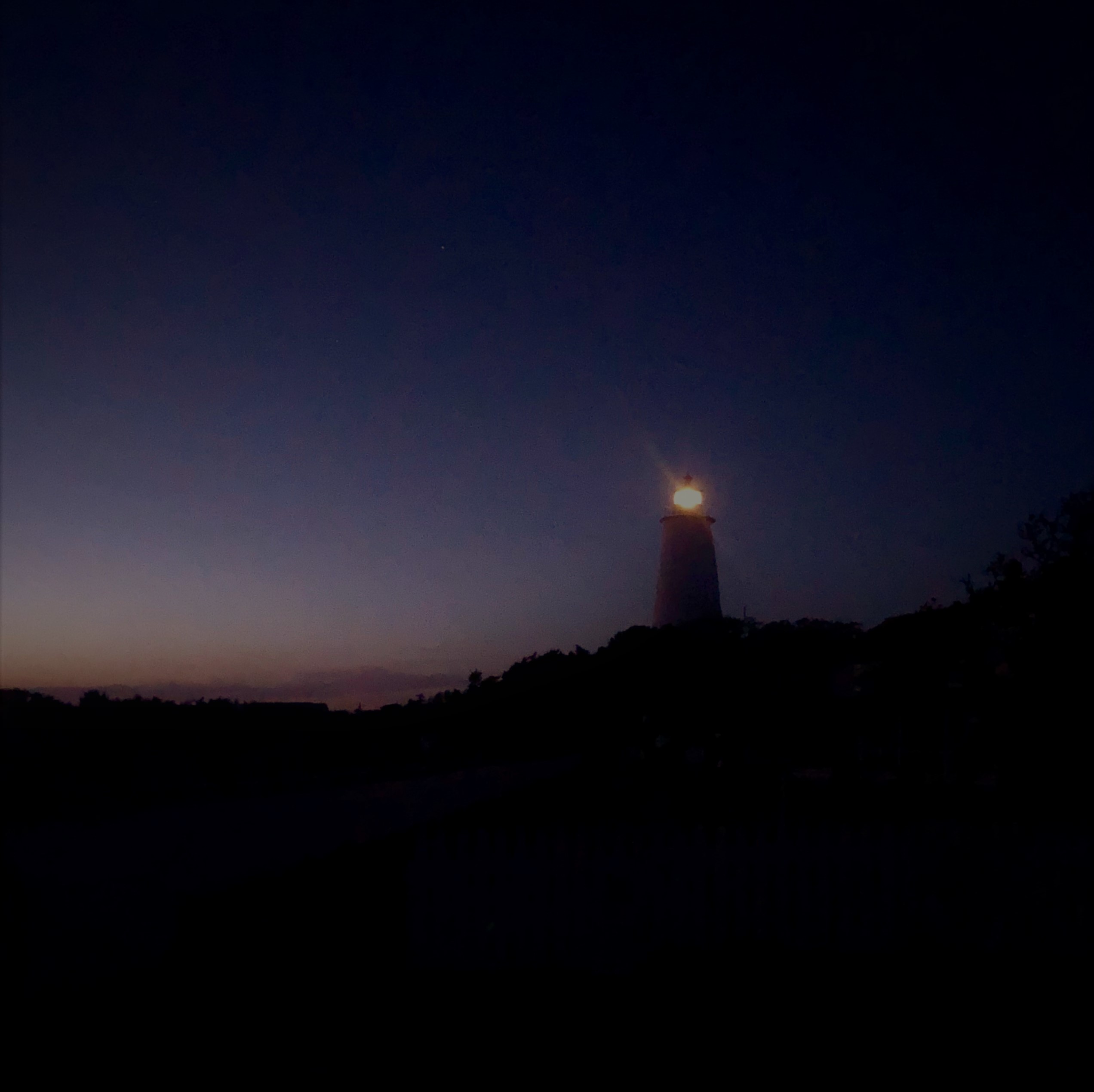 Ocracoke Light shining bright on night it was relit.