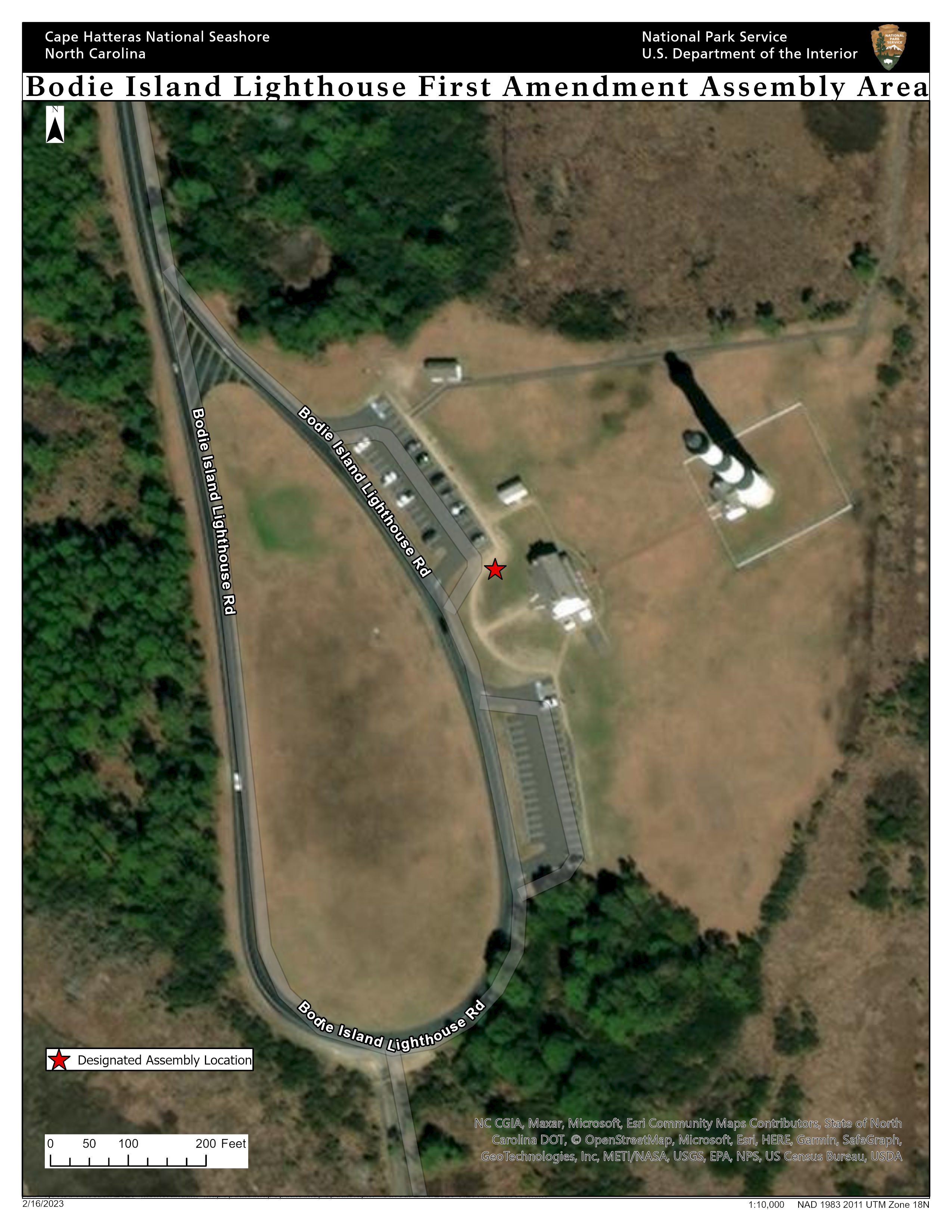 Assembly area at bodie island marked by a red star next to a parking lot