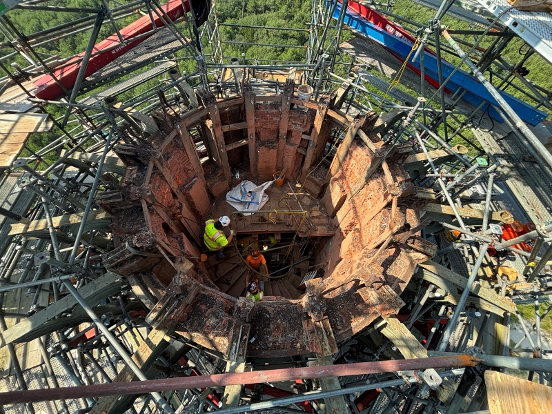 Overhead view of workers removing bricks inside the Cape Hatteras Lighthouse.