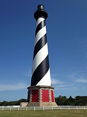 Color photo of the Cape Hatteras Lighthouse on a sunny day.