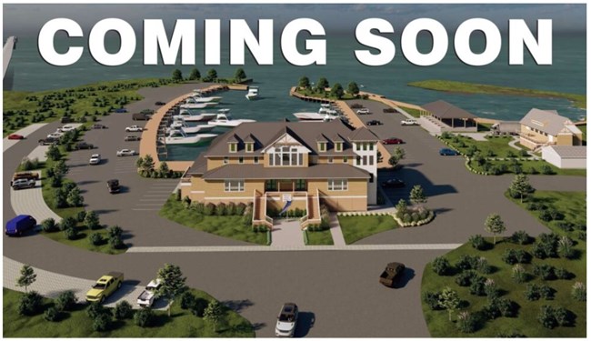Artist rendition of new fishing center set in the marina 2 stories with sound side water in background