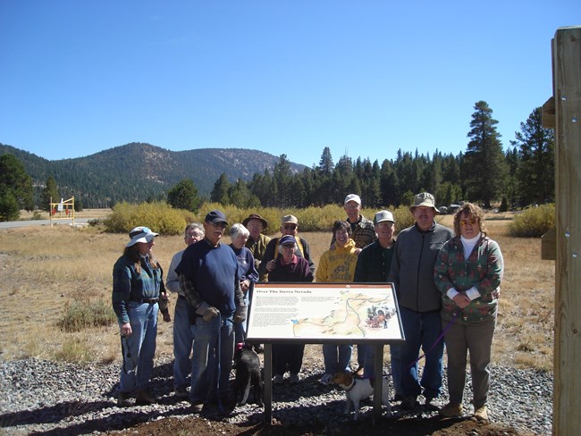 Volunteers from the California-Nevada chapter of the Oregon-California Trails Association (OCTA) complete the installation of a new interpretive exhibit.