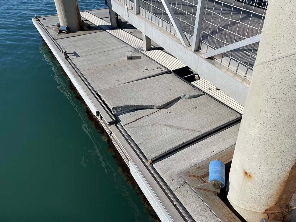 Cracked deck surface in the floating dock caused by recent storm activitiy