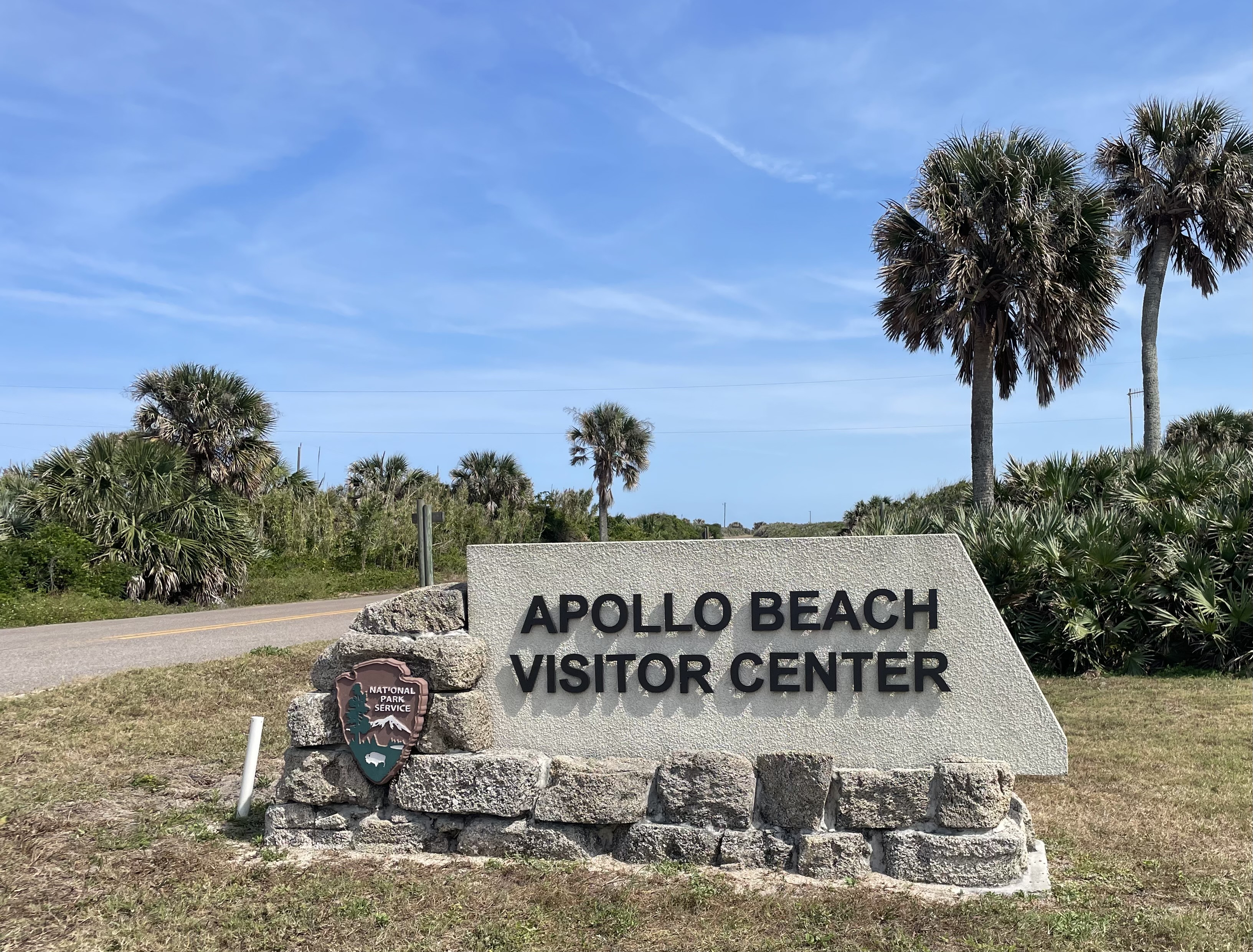 Tan sign with Apollo Beach Visitor Center letters