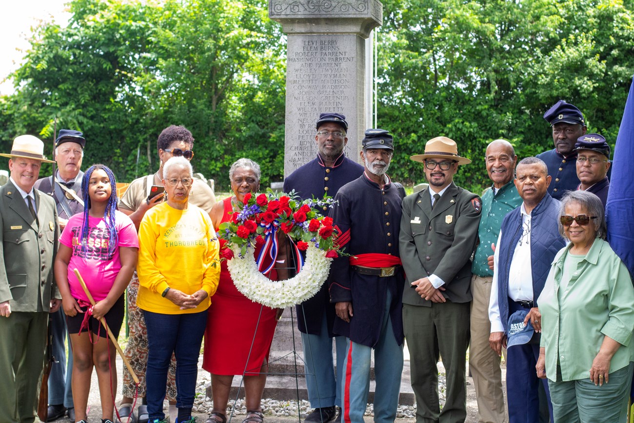 NPS staff and Green Hill Cemetery Board Members at the USCT Monument at Green Hill Cemetery in Frankfort, KY, May 2026.