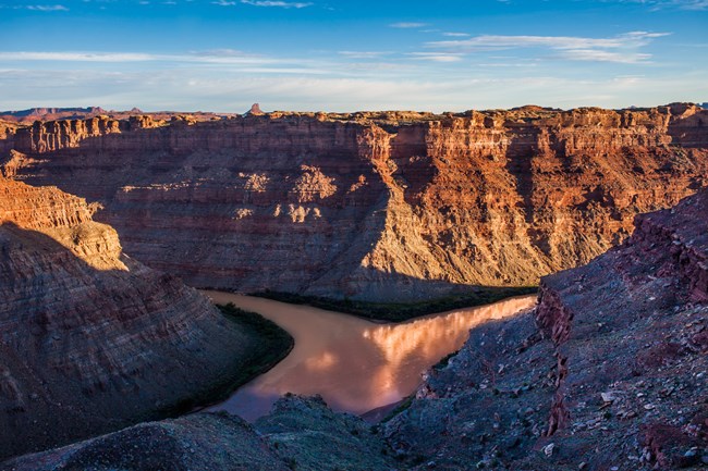 Two large rivers meet deep in a canyon.