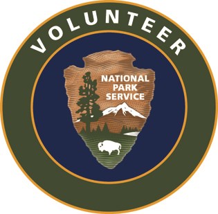 a green circle surrounds the National Park Service arrowhead with the text "Volunteer"
