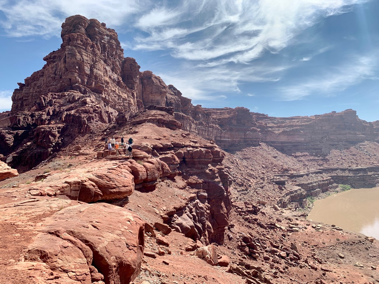 Hikers on a saddle between canyons