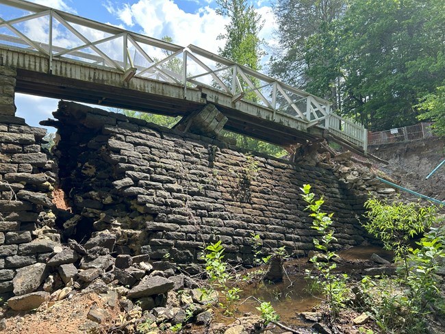 New damage to Front Lake Dam.