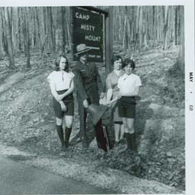 Superintendent Frank Mentzer with Girl Scouts at Camp Misty Mount in 1968.