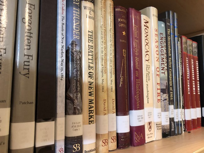 A reference library shelf displays books about the US Civil War.