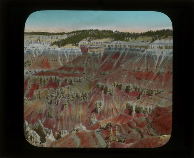 Old slide image of pink and orange cliffs of Cedar Breaks National Monument.