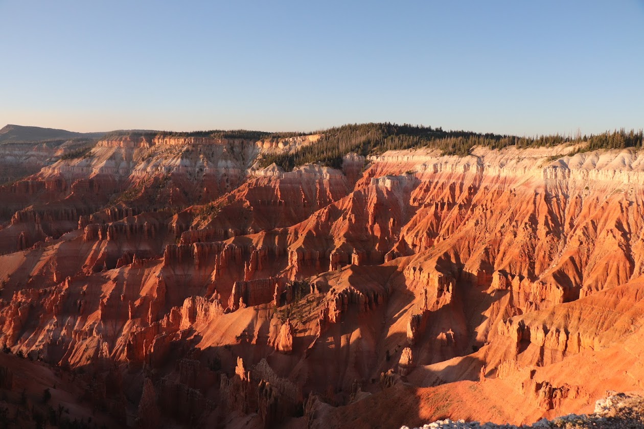 Red cliffs glowing as the sun sets.