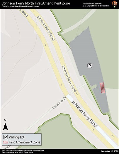 First Amendment Zone is the first four parking spaces to the right of the access road that passes through the paved parking lot.