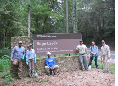 Crew in front of Sope Creek entrance sign