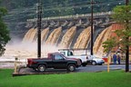 A view of flood waters flowing over the spillways at Morgan Falls Dam. Gates for all spillways are open.