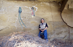 Jane Kobler posing against a rock face