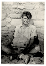 Gwinn Vivian smiling while holding a pot.