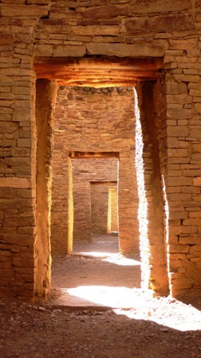 Photo looking through a series of doorways at Pueblo Bonito