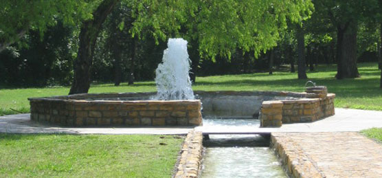 Artesian well in masonary basin