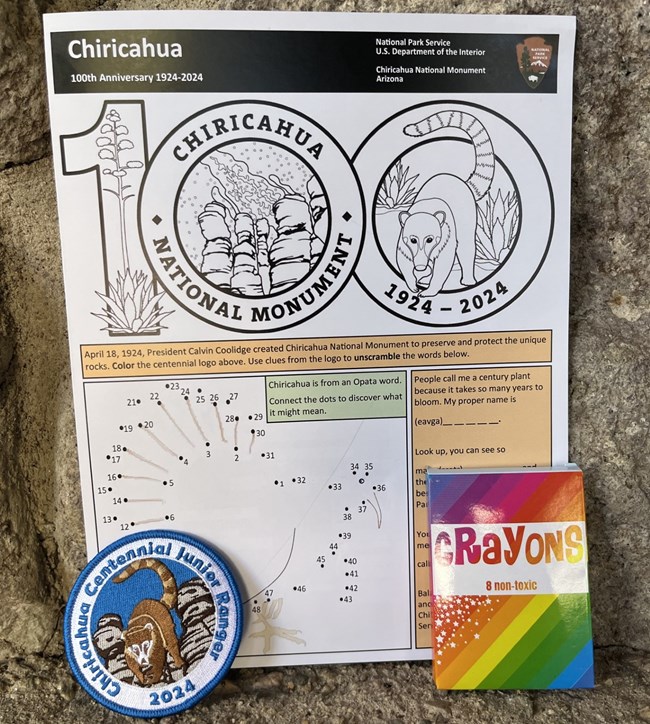 Centennial junior ranger book, patch, and crayons