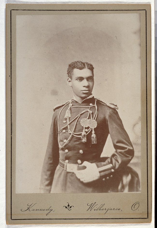Young African American soldier in military dress uniform.