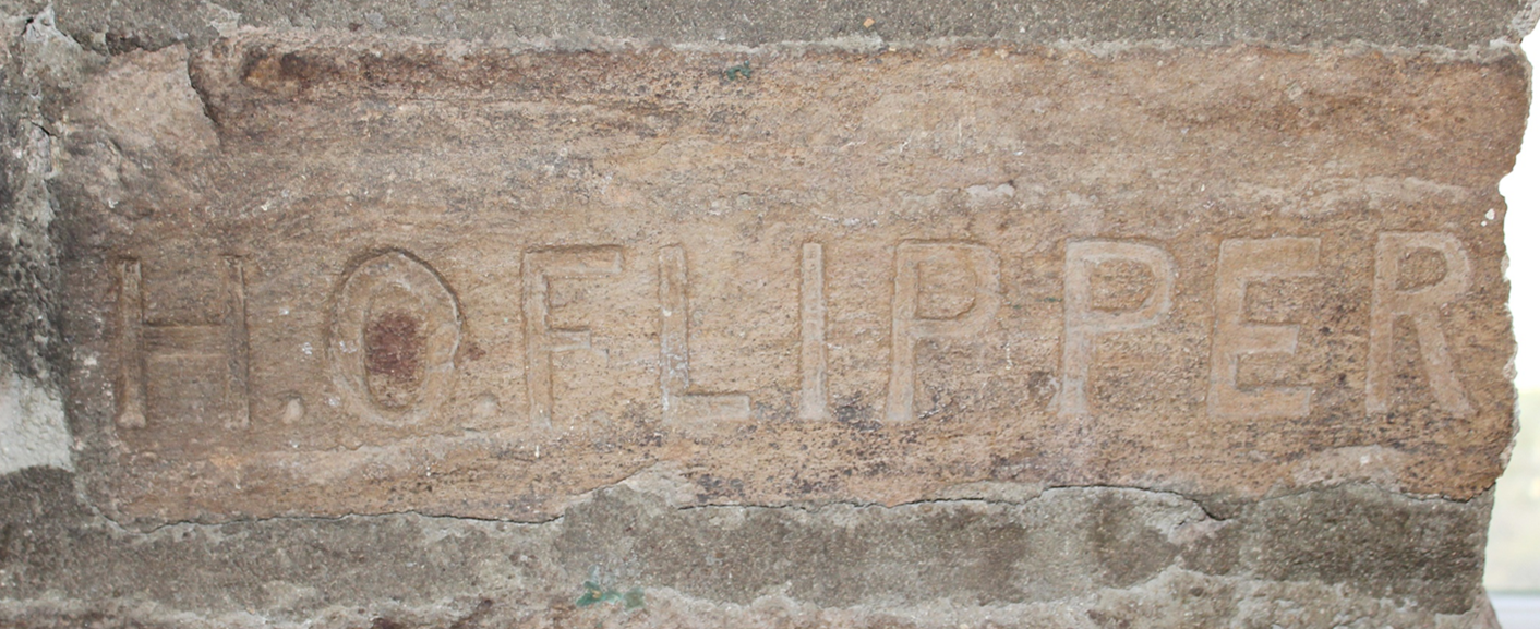 Stone carved with H. O. Flipper