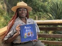 Park Ranger holding a book.