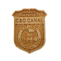 Wooden C&O Canal NHP Junior Ranger badge.
