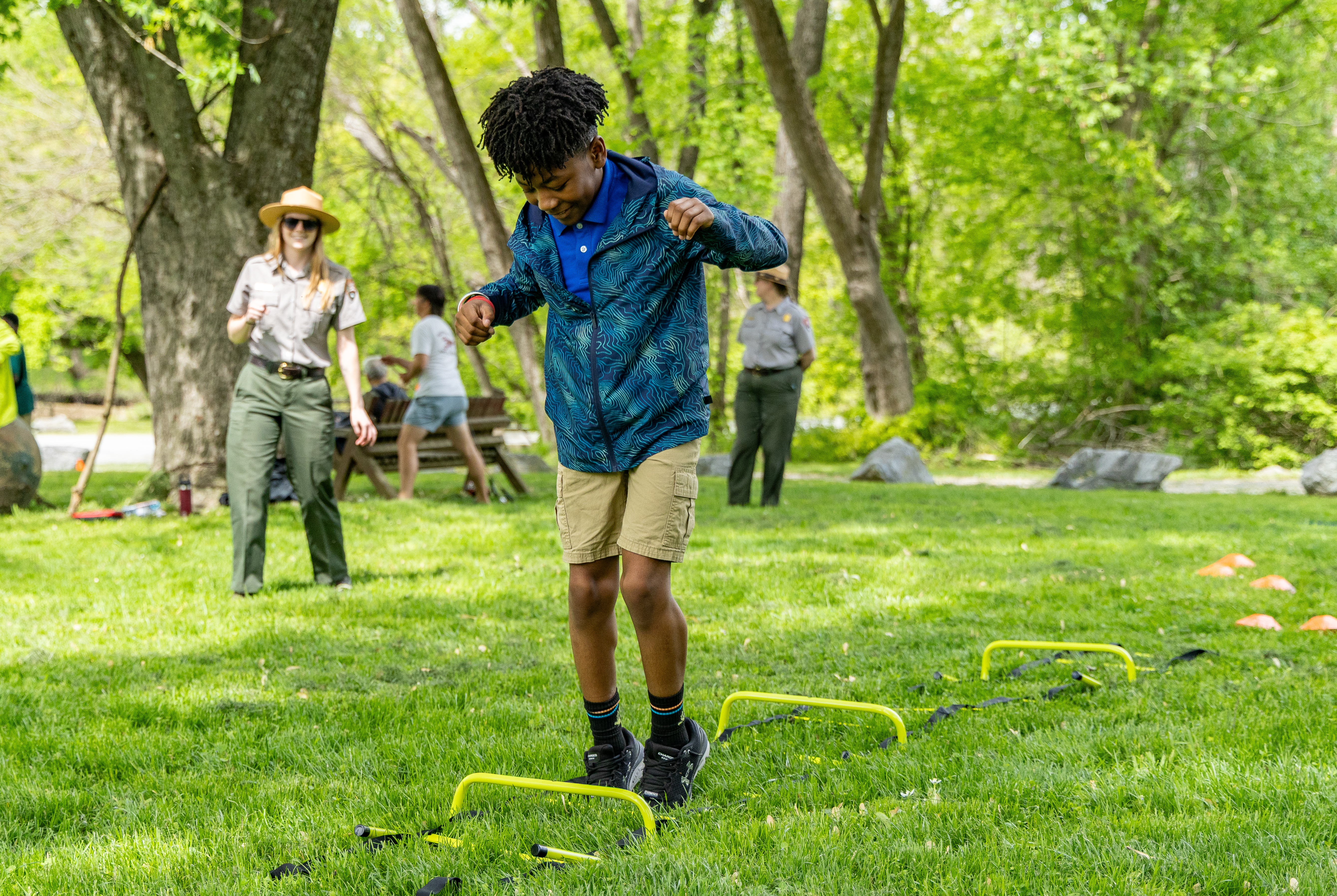 Twelve-year-old Kenard Brisbon, a Washington Global Public Charter School student, participates in an obstacle course meant to simulate the Shad Run at Fletcher’s Cove on Earth Day, April 22, 2025