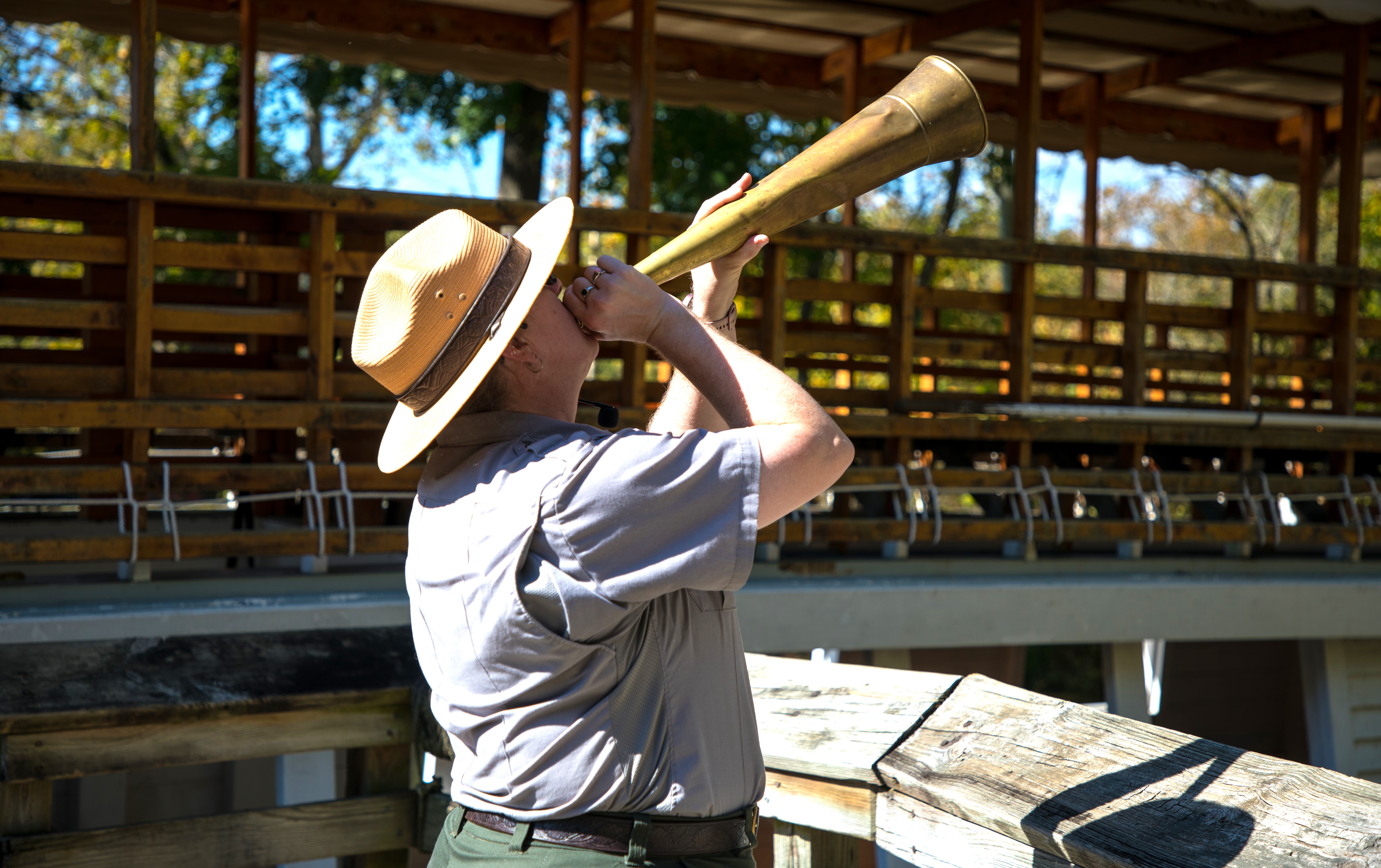 Park ranger blowing a boat horn