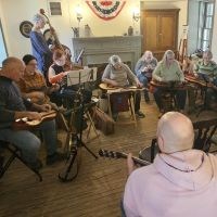 Musicians playing 19th century instruments