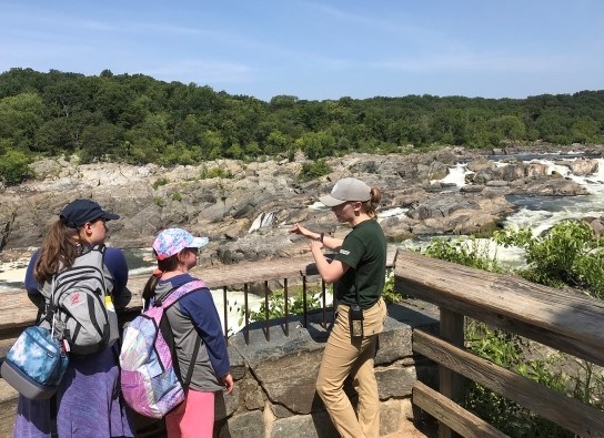 Intern and visitors at Great Falls Overlook