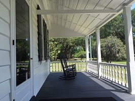 Front porch of house and rocking chairs