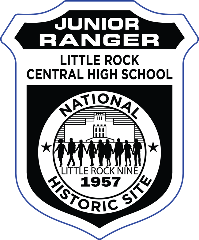 Black and white Junior Ranger badge for Little Rock Central High School National Historic Site. The badge features the silhouette of the Little Rock Nine holding hands in front of the school building, with the year 1957 displayed below.