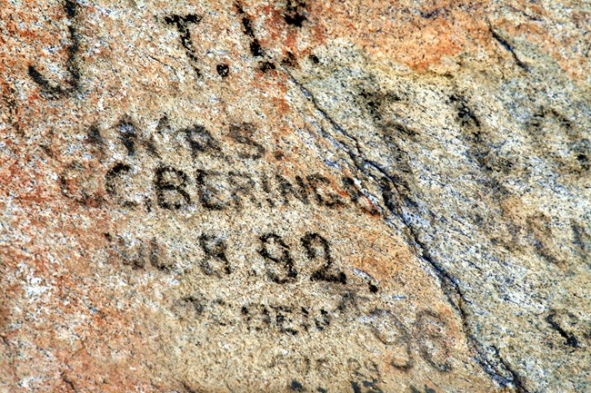 Historic emigrant signatures done in axle grease on granite.