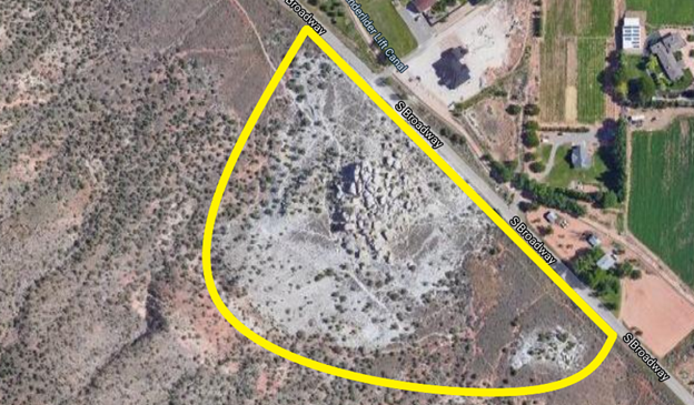 Aerial image of the White Rocks rock formation with the formation outlined in yellow highlighter.