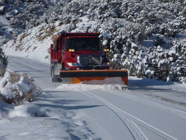 Snow plow clearing Rim Rock Drive