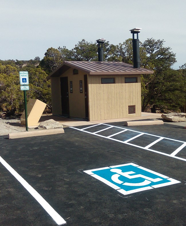 Vault Toilet at Upper Liberty Cap Trailhead with paved accessible parking.