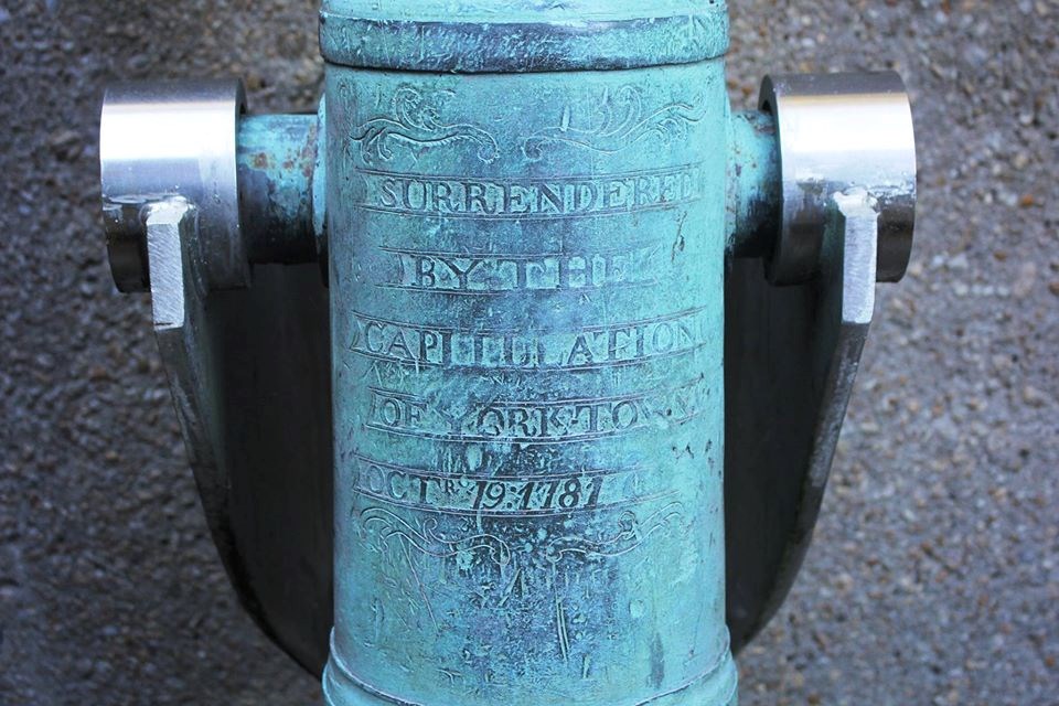 An inscription on a cannon reads "surrendered by the capitulation of Yorktown Oct 1781
