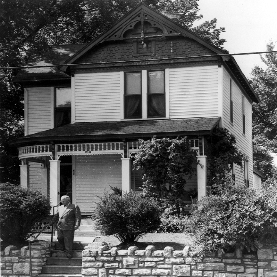 Victorian house, President Harry S Truman descending stone steps in front