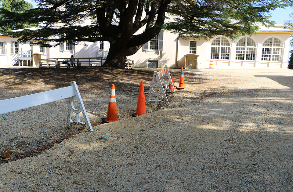 Behind the house, area with large ravine from erosion.