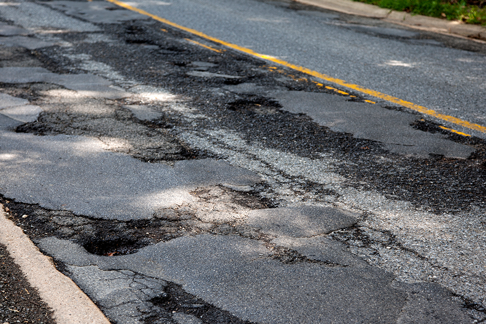 Road with patches and potholes