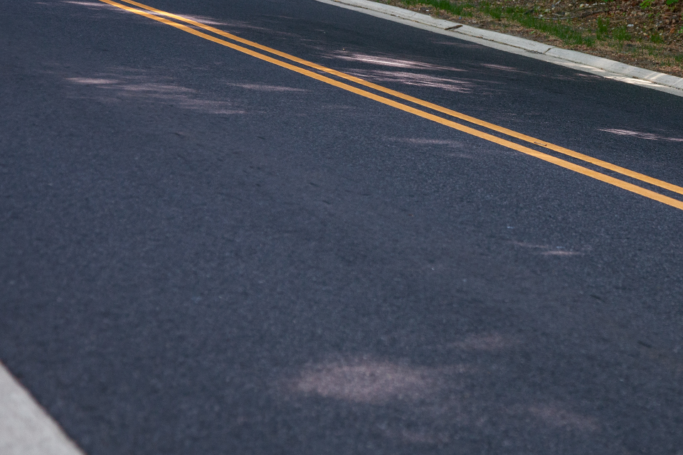 Road with patches and potholes